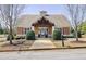 Charming community clubhouse with gabled roof, symmetrical design, and landscaped grounds at 2157 Capella Sw Cir, Atlanta, GA 30331
