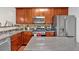 Well-equipped kitchen featuring stainless steel appliances, granite countertops, and ample cabinet space at 2157 Capella Sw Cir, Atlanta, GA 30331