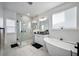 Luxurious bathroom with soaking tub and glass enclosed shower at 3208 Sonnet Se Walk, Atlanta, GA 30339