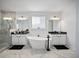 Well-appointed bathroom with double vanities and marble floors at 3208 Sonnet Se Walk, Atlanta, GA 30339