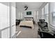 Well-lit bedroom featuring a ceiling fan, a desk and a comfortable bed with stylish pillows and a bedspread at 3208 Sonnet Se Walk, Atlanta, GA 30339