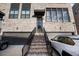 Inviting home entrance featuring a brick staircase, modern door, and attached garage for convenient parking at 3208 Sonnet Se Walk, Atlanta, GA 30339