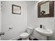 Half bathroom with a vessel sink, framed mirror, and modern fixtures at 3208 Sonnet Se Walk, Atlanta, GA 30339