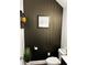 Chic powder room featuring textured wallpaper and stylish decorative accents at 3208 Sonnet Se Walk, Atlanta, GA 30339