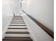 Staircase with dark wood steps and bright white risers at 3208 Sonnet Se Walk, Atlanta, GA 30339