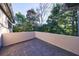 Second-story balcony offering natural sunlight and a view of the treetops and surrounding landscape at 3491 Roswell Ne Rd, Atlanta, GA 30305