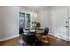 Bright dining room featuring modern lighting, garden view, and hardwood floors at 3491 Roswell Ne Rd, Atlanta, GA 30305