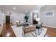 Cozy living room with hardwood floors, gray walls, a fireplace and a large plush rug at 3491 Roswell Ne Rd, Atlanta, GA 30305