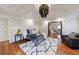 Cozy main bedroom with hardwood floors, an area rug, and a relaxing sitting area at 3491 Roswell Ne Rd, Atlanta, GA 30305