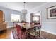 Sunlit dining room with a table, chairs, and a view into the living room at 728 Burke Rd, Atlanta, GA 30305