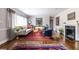 Bright living room with hardwood floors, fireplace, and natural light at 728 Burke Rd, Atlanta, GA 30305