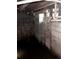 Unfinished basement with concrete block walls, visible plumbing and standing water at 1771 Hosea L Williams Se Dr, Atlanta, GA 30317