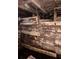 Unfinished basement with exposed wooden beams, pipes, and water damage requires extensive renovation and repair at 1771 Hosea L Williams Se Dr, Atlanta, GA 30317