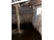 Unfinished basement with concrete block walls, visible plumbing and standing water at 1771 Hosea L Williams Se Dr, Atlanta, GA 30317