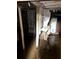 Flooded basement featuring support columns, exposed piping, and water heater at 1771 Hosea L Williams Se Dr, Atlanta, GA 30317