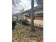 Overgrown yard and weathered exterior view of home at 1771 Hosea L Williams Se Dr, Atlanta, GA 30317