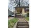 Exterior of a house with weathered steps leading to the front porch and entrance at 1771 Hosea L Williams Se Dr, Atlanta, GA 30317