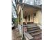 Exterior of a weathered home with visible foundation and steps leading to the entrance at 1771 Hosea L Williams Se Dr, Atlanta, GA 30317