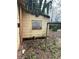 Exterior view of home with peeling paint, siding damage, and boarded up windows needing repair at 1771 Hosea L Williams Se Dr, Atlanta, GA 30317