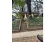 Exterior view of a small, overgrown house with a prominent 'No Trespassing' sign and stairs leading up to the porch at 1771 Hosea L Williams Se Dr, Atlanta, GA 30317