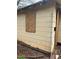 Exterior view of home with peeling paint, siding damage, and boarded up windows needing repair at 1771 Hosea L Williams Se Dr, Atlanta, GA 30317