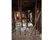 Inside the home, the wall studs and floors are exposed at 1771 Hosea L Williams Se Dr, Atlanta, GA 30317