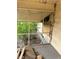 View from a screened porch with a deteriorated floor and overgrown foliage outside at 1771 Hosea L Williams Se Dr, Atlanta, GA 30317