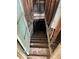 Stairway leading to the basement of an abandoned house with deteriorating wood at 1771 Hosea L Williams Se Dr, Atlanta, GA 30317