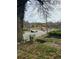 View of a street corner with a crosswalk and intersection, overgrown shrubs, and cars on the road at 1771 Hosea L Williams Se Dr, Atlanta, GA 30317