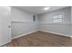 Cozy bedroom features wood-look floors, gray walls, and a window for natural light at 4833 Chapelle Ct, Marietta, GA 30066