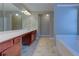 Bathroom showcasing a double vanity, tile flooring, and a separate shower and tub at 922 Gardenia Curv, Canton, GA 30114