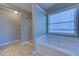 Bathroom showcasing a shower, bath, window, and sink with vanity at 922 Gardenia Curv, Canton, GA 30114