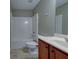 Bathroom featuring a bath, shower, and single sink with vanity at 922 Gardenia Curv, Canton, GA 30114