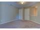 Bedroom featuring two closets, neutral tones, and plush carpet at 922 Gardenia Curv, Canton, GA 30114