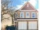 Charming two-story home with a stone facade and attached two-car garage at 922 Gardenia Curv, Canton, GA 30114