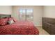 Comfortable bedroom with natural light and dresser at 11930 Guelph Cir, Hampton, GA 30228
