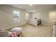 Spacious bedroom with large windows and neutral carpet at 11930 Guelph Cir, Hampton, GA 30228
