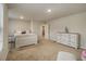 Spacious bedroom featuring a large window and neutral carpet at 11930 Guelph Cir, Hampton, GA 30228