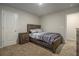 Bedroom with wood frame bed and a matching nightstand at 11930 Guelph Cir, Hampton, GA 30228