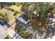Aerial view of the home showcasing its driveway, large backyard, and mature trees at 2776 Grand Sw Ave, Atlanta, GA 30315