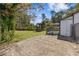 Spacious backyard with mature trees, a concrete patio, grass and a gazebo, perfect for outdoor activities and relaxation at 2776 Grand Sw Ave, Atlanta, GA 30315
