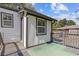 Backyard exterior featuring a small deck, well-maintained yard, and a fenced perimeter at 2776 Grand Sw Ave, Atlanta, GA 30315