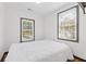 A bedroom with natural light showcasing hardwood flooring, white walls, and a window at 2776 Grand Sw Ave, Atlanta, GA 30315