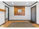 Inviting entryway featuring wood accent wall, contemporary rug, and stylish decor at 2776 Grand Sw Ave, Atlanta, GA 30315