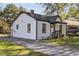 Quaint house with dark trim and a welcoming front porch, situated on a grassy lot at 2776 Grand Sw Ave, Atlanta, GA 30315