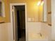 Bathroom featuring classic white tiling, ample storage space, and a clean, functional layout at 5586 Kingsport Dr, Atlanta, GA 30342