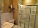Well-lit bathroom features a glass-enclosed shower, classic fixtures, and efficient use of space for daily routines at 5586 Kingsport Dr, Atlanta, GA 30342