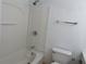 Bathroom with a shower and tub combination and standard toilet at 5586 Kingsport Dr, Atlanta, GA 30342