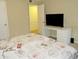 The room has a comfortable bedroom setup with a desk and entertainment options, perfect for relaxation and productivity at 5586 Kingsport Dr, Atlanta, GA 30342