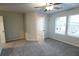 Bedroom with carpet, ceiling fan, and large window at 8658 Webb Rd, Riverdale, GA 30274